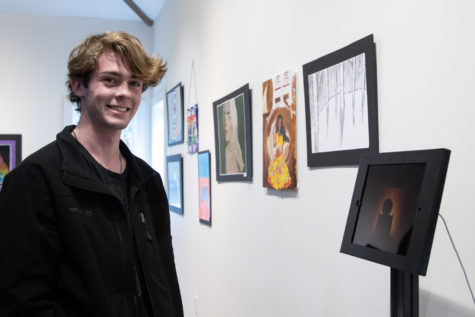 Senior Noah Sacks shares an interactive display of his video at the biannual Art of WSSD show in spring 2022.