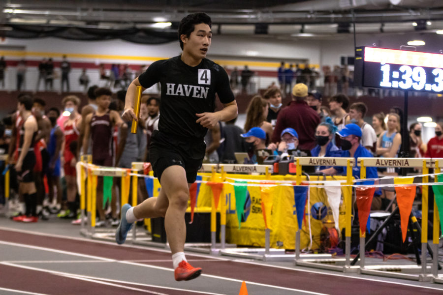 Senior Jed Liu competes in relay at the indoor track meet on February 12.