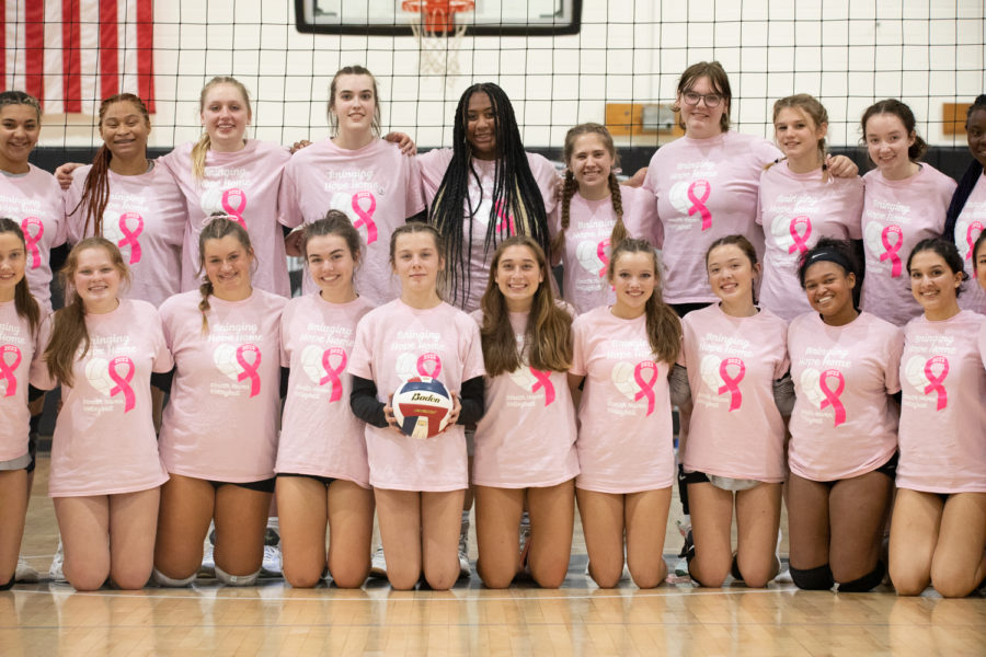 The Haven Volley Ball Team poses for a photo in their Bringing Hope Home shirts. 