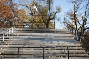 The photograph included with this article in the original issue was intended to be a general representation of the student section. The photograph was used for illustrative purposes, and was not intended to single out any specific individuals. 