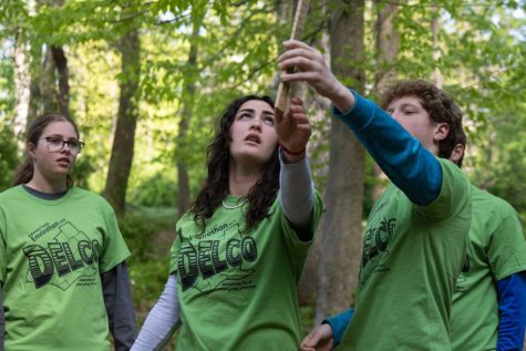 “The Plant-hers,” sophomore Ella Liberi, senior Mackenzie Murray, freshman Will Reitmeyer, and senior Owen Brennan, hold up a Biltmore stick, a tool used to find the volume of a tree, in order to answer a question on the forestry test.
