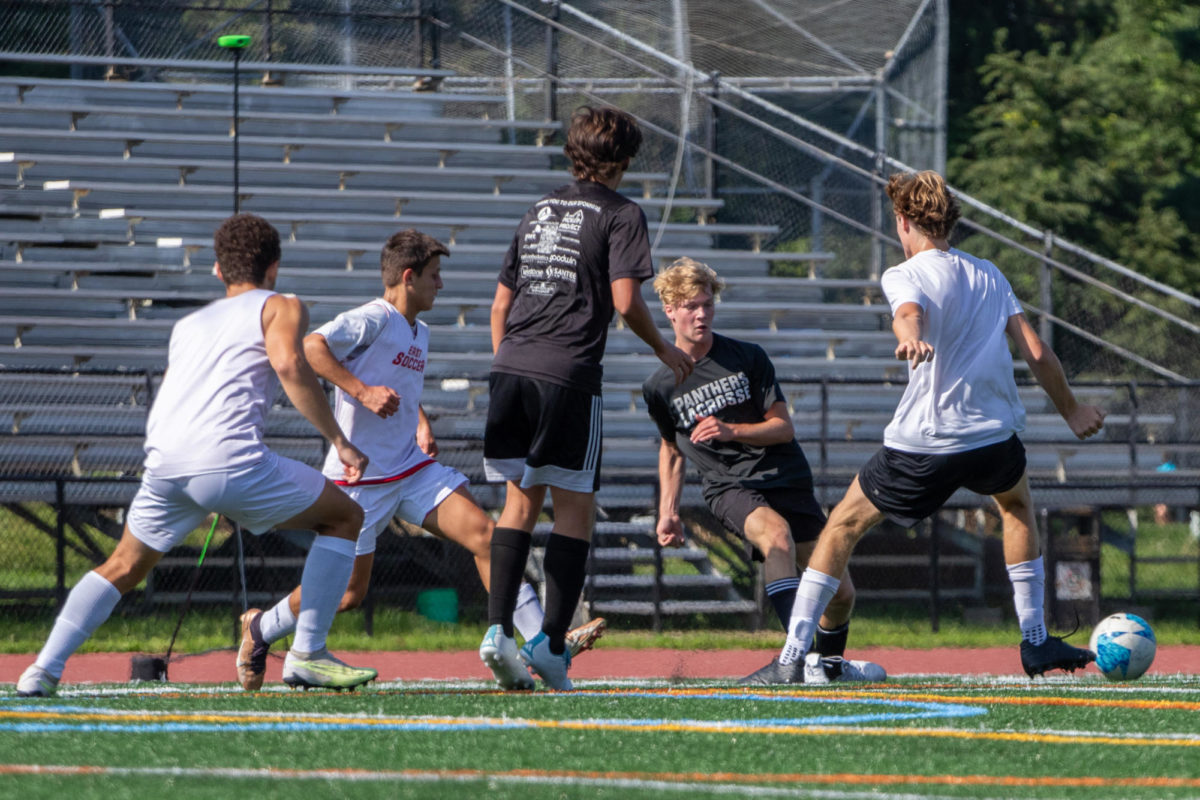 Maxwell Zarko passes the ball.