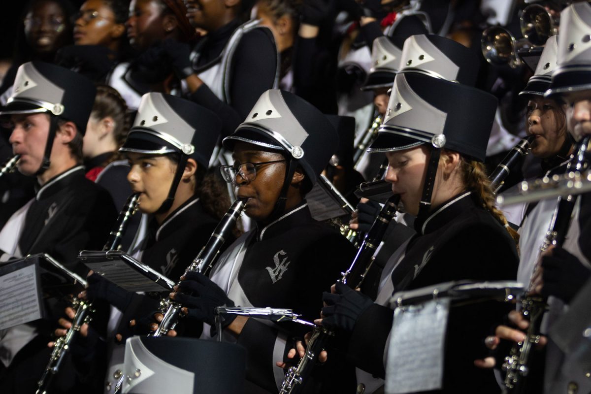 Members of the marching bands clarinet section perform at the football game versus Springfield on Sept. 1.