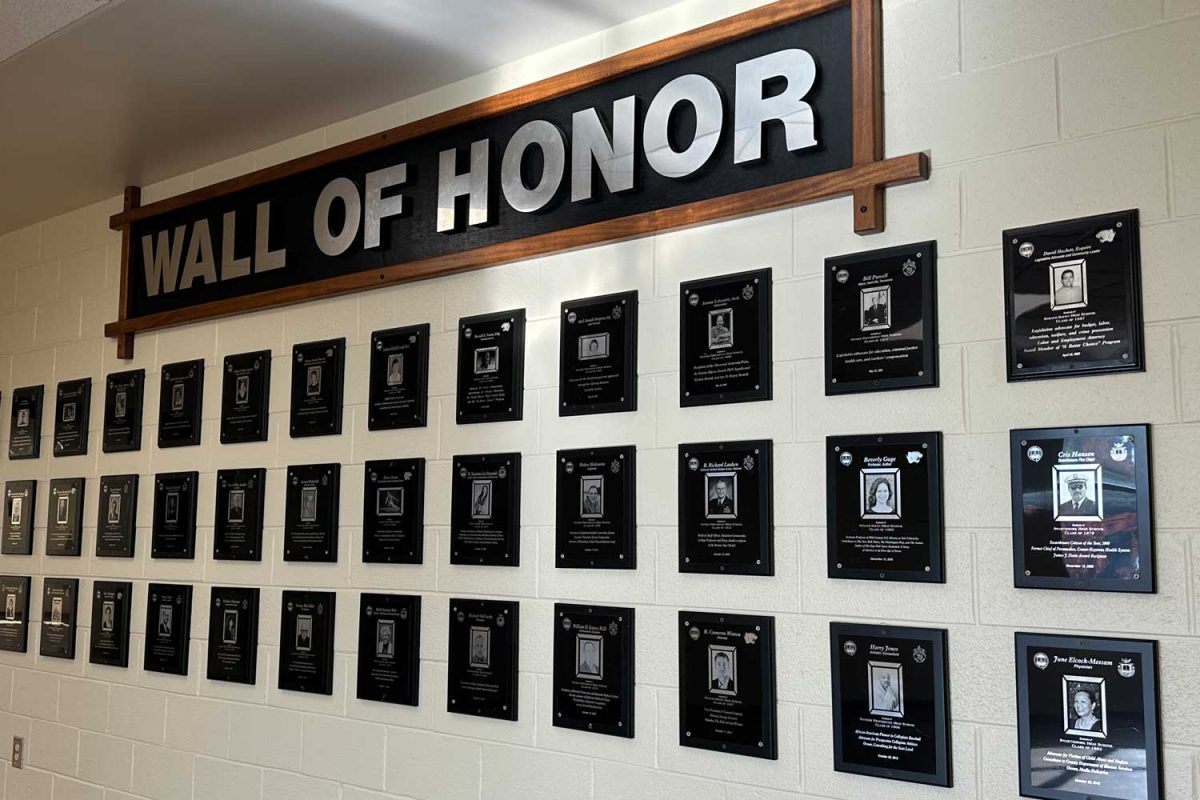 Students+can+browse+the+Wall+of+Honor+in+the+third+floor+lobby.+There+have+been+no+new+inductees+since+2021.+
