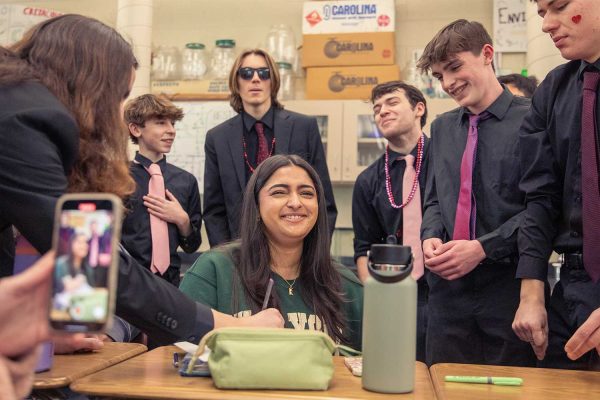 The Silvetones boys ensemble serenade senior Priya Sidhu on Wednesday, February 14. The Silvertones sang small acapella pieces of popular songs for their annual tradition of Singing Valentines. “It's fun to embarrass people, in a nice way, and I like to see their reactions” sophomore Silvertone, Ryan Markey said.