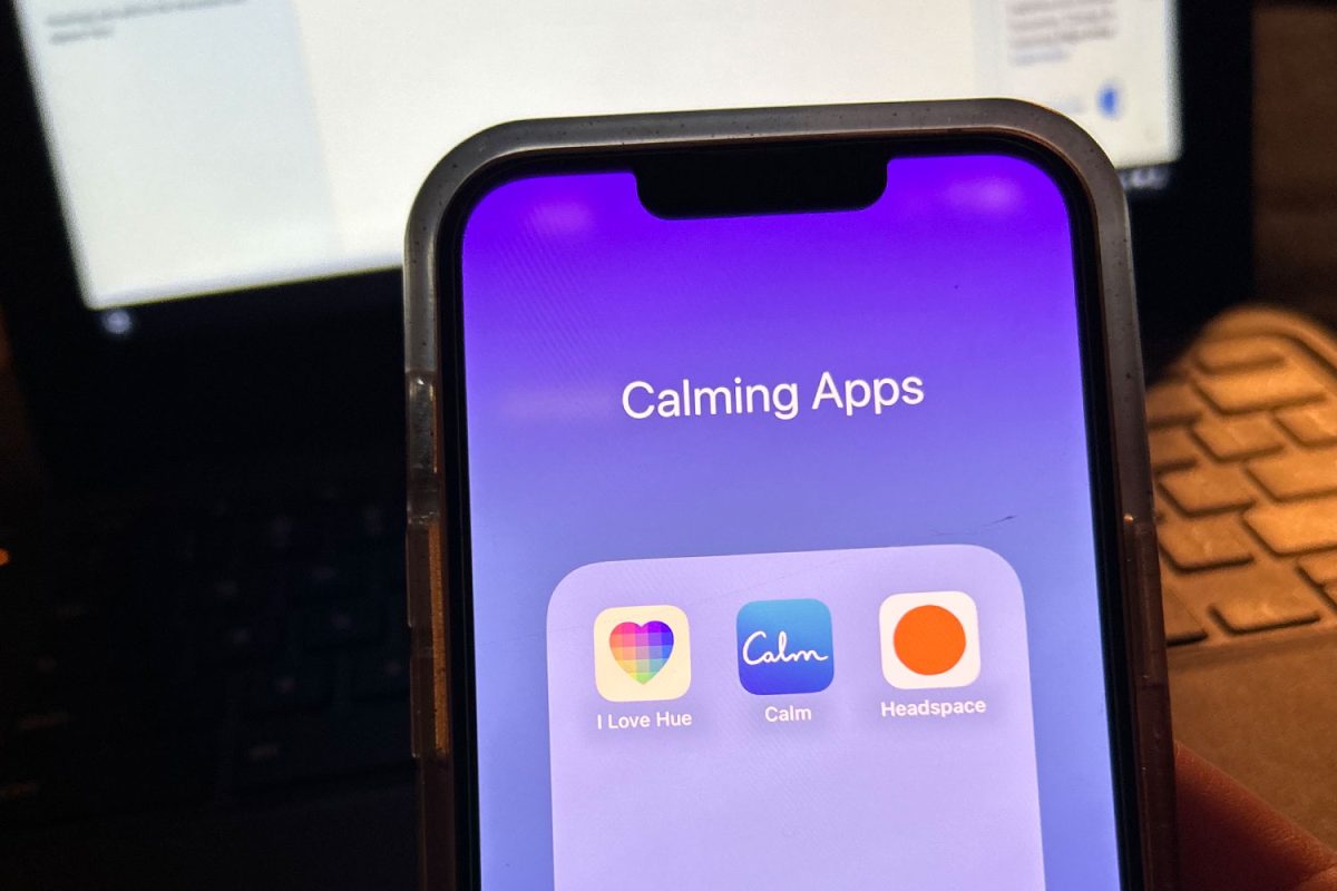A+student+accesses+the+stress+management+apps+on+their+phone.%0A