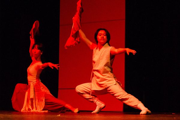 FEATURED: Senior Joe Hsu dances during the International Day performance on April  5.