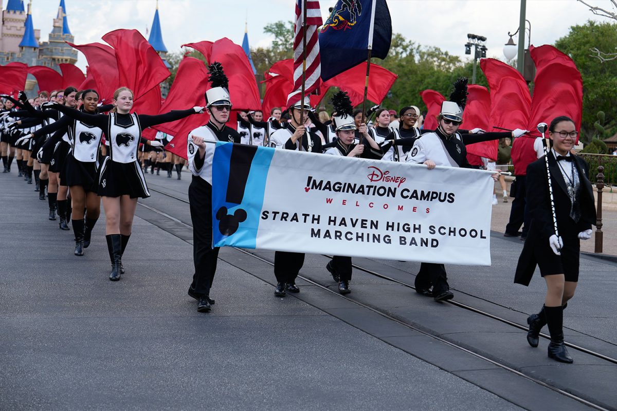 Haven’s Marching Band marches down Main Street, performing to Disney songs.