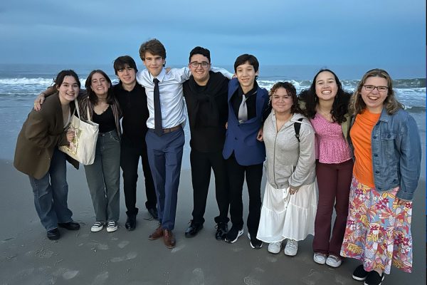 Members of the jazz band pose for a group photo in front of the ocean at Rehoboth Beach on Friday, May 17. PHOTO PROVIDED BY MATTEO VENTRESCA