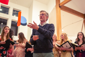 Music Director John Shankweiler addresses the audience at the Wallingford Community Arts Center during the Silvertones Twelfth Night Revelry concert fundraiser on Saturday January 7, for their spring trip to Sicily, Italy.