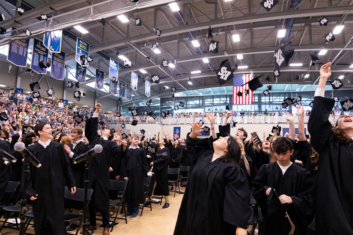 The Class of 2024 throw their mortarboard hats after the turning of the tassel.
