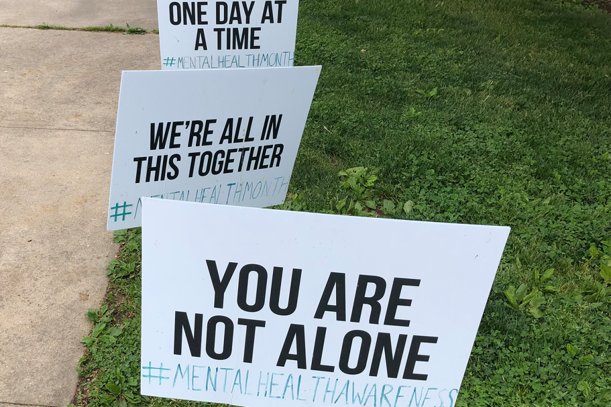 Posters hang outside the middle school in support of mental health awareness. The posters can also be found at the high school.