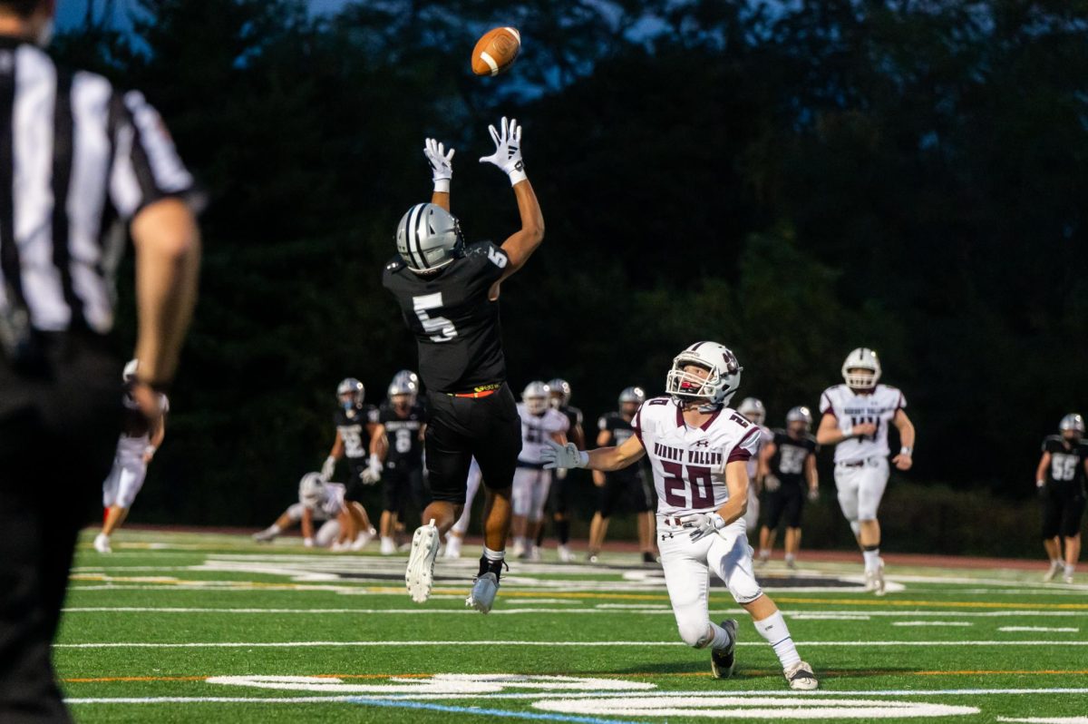 Strath Haven senior wide receiver James Fisher catches a pass from quarterback Caden Shuster during Friday’s conference match up against Garnet Valley on September 20. Fisher tied the game early into the first quarter with a touchdown bringing the score to 7-7.