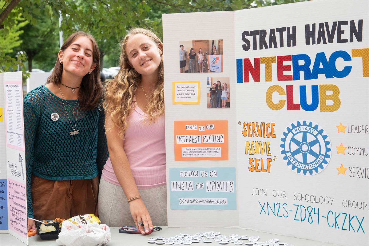 Juniors Josie Wieland and Lexi Benzing recruit new members for the reinstated Interact Club at the Activities Fair on September 6.