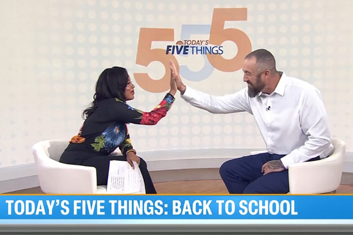 English teacher Mr. Kevin Haney high-fives Today Show host Sheinelle Jones at the end of the segment on August 27. Haney traveled to New York City to appear live on the show. 