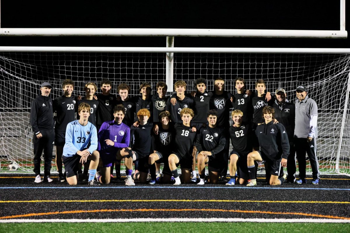 The boys varsity soccer team poses for a photo after their final game of the season at King Field on Friday, October 18.