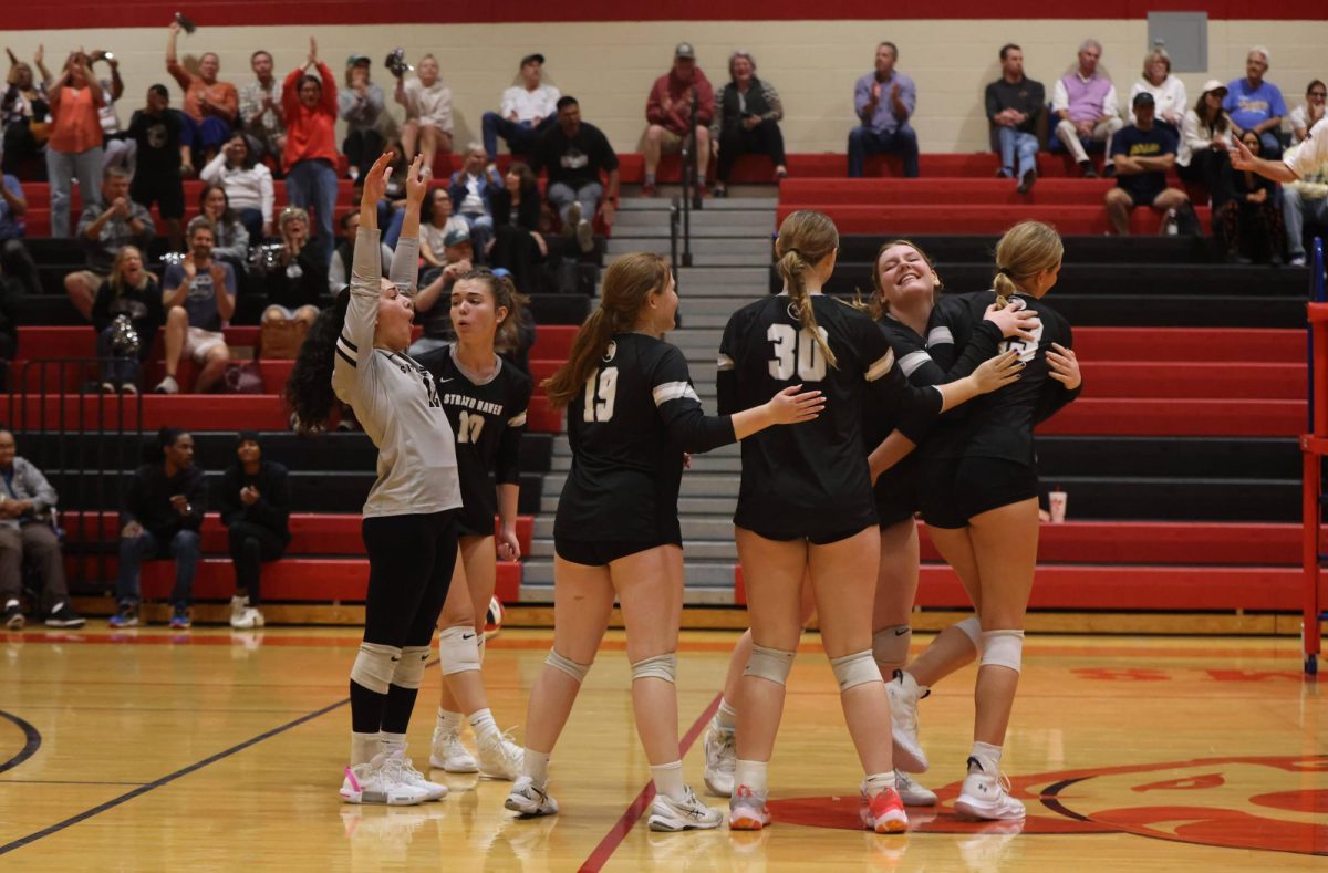 The Panthers celebrate a point off of a block from sophomore Cecilia Lndsay at Harriton High School on October 31.