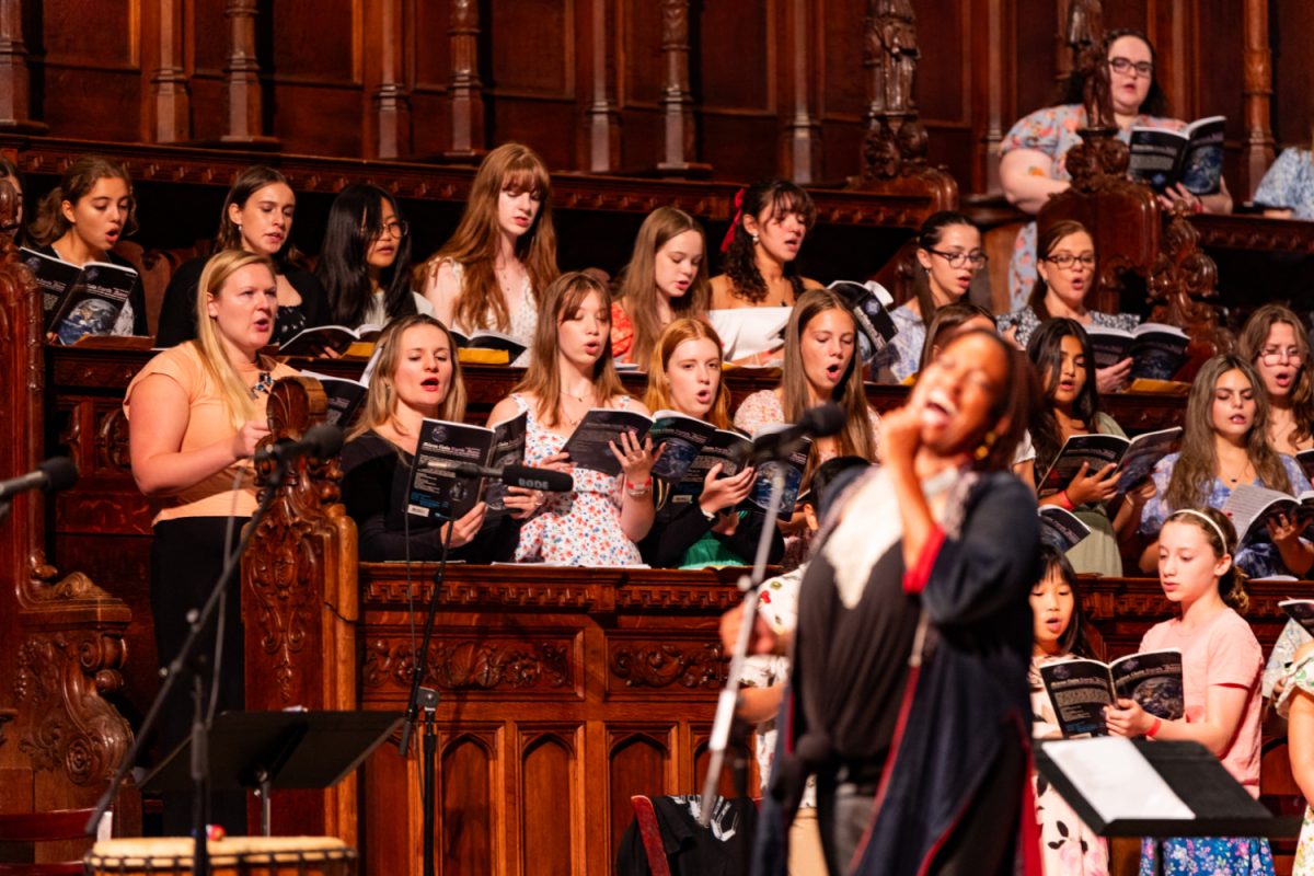 Soprano Cantata members sing during the Feast of St. Francis mass in the Cathedral of St. John Divine on Sunday, October 6. The choir was a combination of various singers which included Strath Haven Cantata, The Cathedral Choristers, choirs from Villanova University, surrounding schools, and people who wanted to be part of the mass.