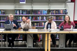 Interim Superintendent Mr. James Scanlon, Board President Mr. Kevin Henry, Board Vice President Mrs. Kelly Wachtman, and Board Member Mrs. Michelle Williams prepare for the November 18 regular school board meeting.