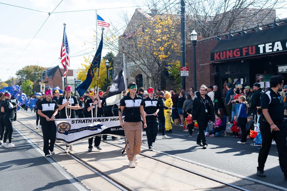 The Panther Marching Band marches along State St. in a Halloween-themed parade in Media, Pa on the morning of Saturday, October 26.