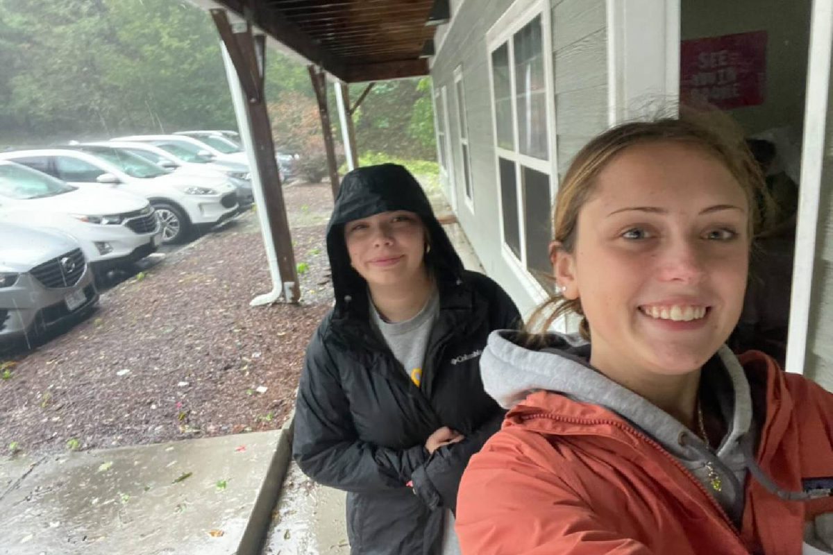 Sophomore Appalachian student Georgia Gianopoulos takes a selfie with a friend while in the midst of torrent downpour. 