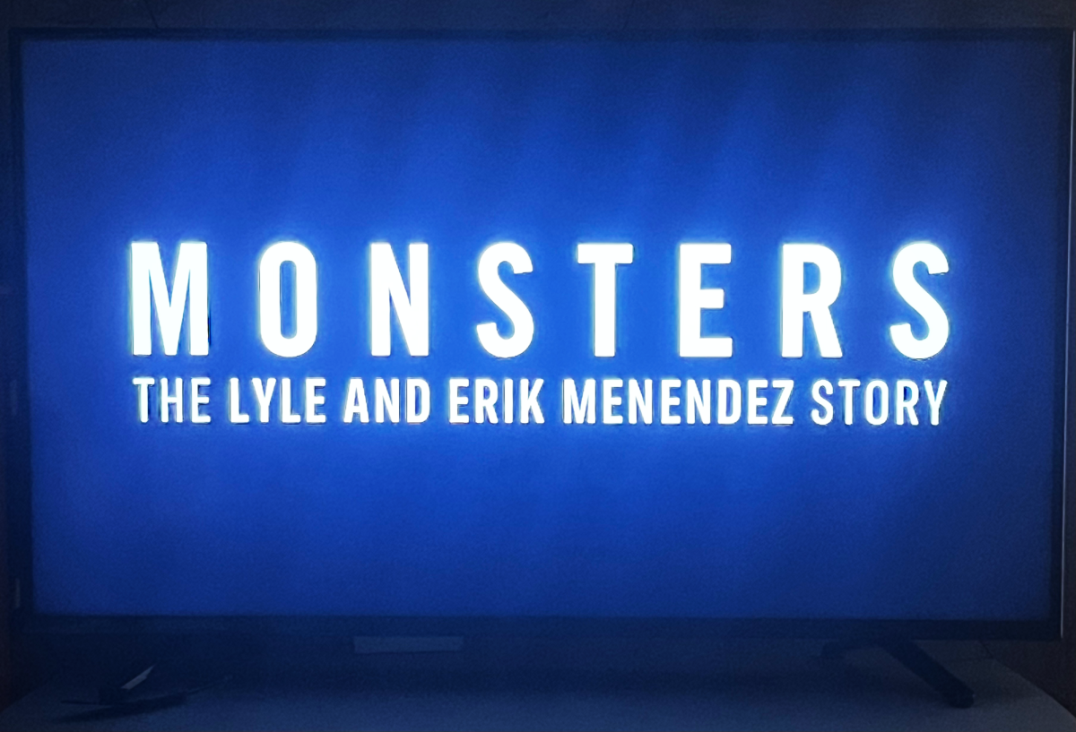 The intro title to the documentary ‘Monsters’ plays on a TV in a dark room.