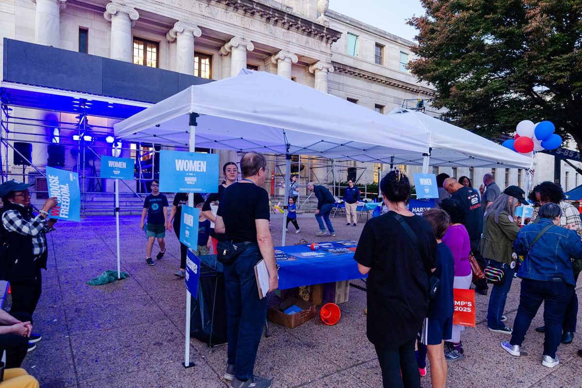 Community members surround tables of a voter registration rally in Media, PA on Wednesday, October 23. 