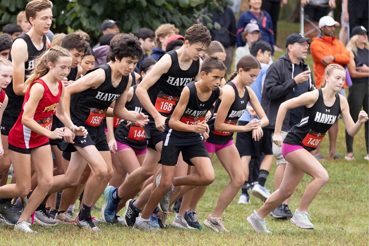 The junior varsity girls and boys cross country teams take off from the starting line at the Delco Championships on September 28. This year, they receive new shirts and bottoms uniform. 