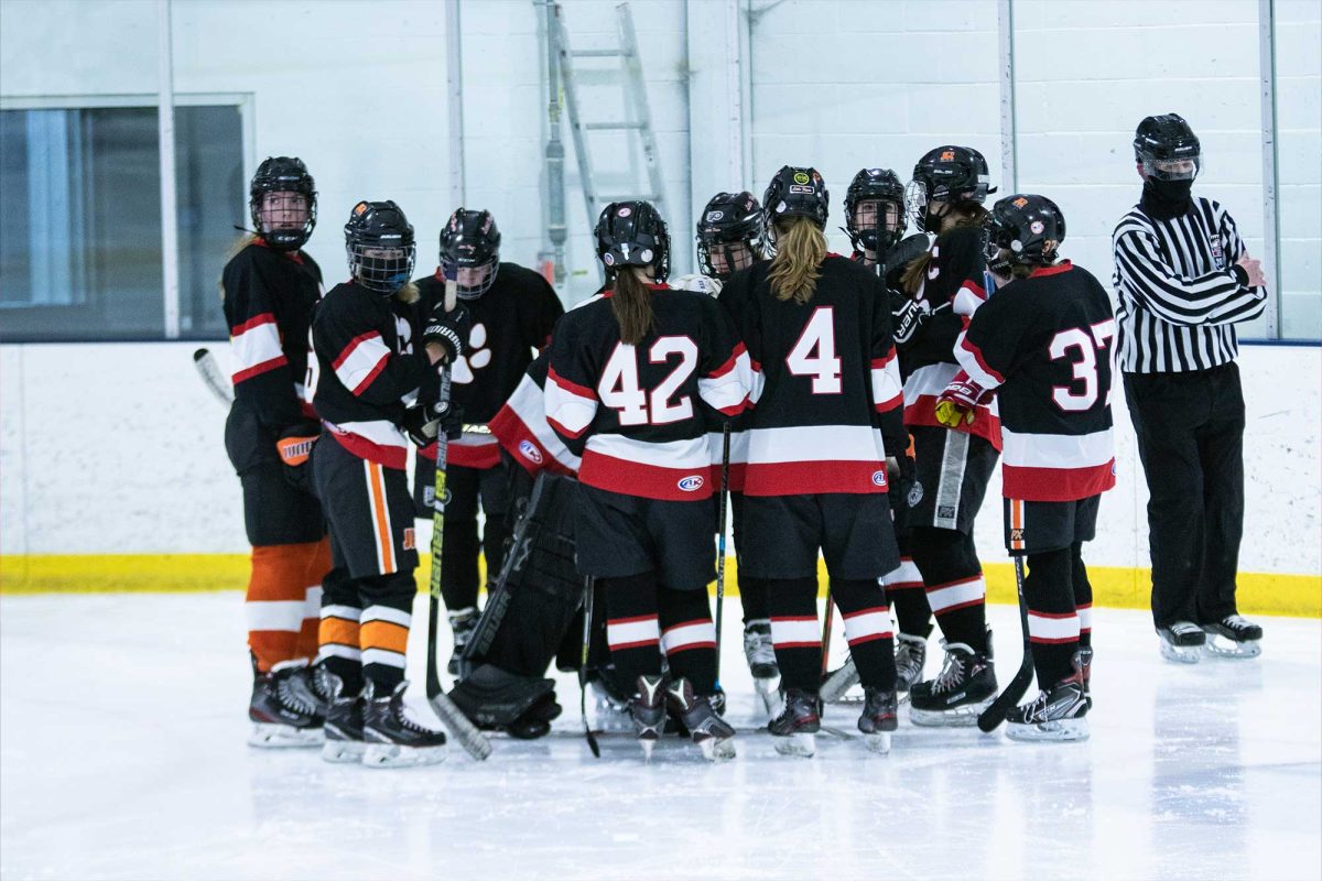 The PennHaven girls ice hockey meets before a game in winter 2021. The team went on to win a league championship that year, but Haven students no longer compete in girls hockey as a  sponsored club sport.