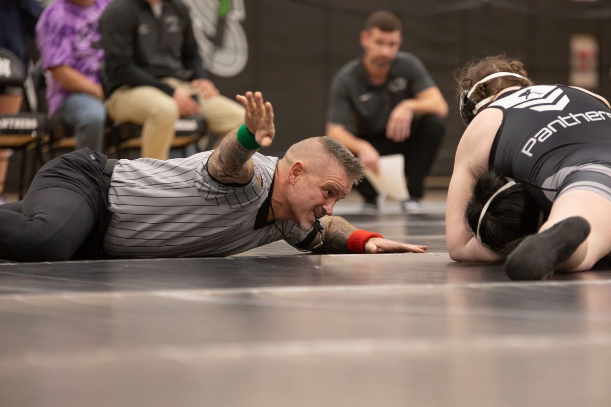 Haven alumnus and Ridley High School dean Mr. Eric Hollingsworth serves as an official at the girls wrestling meet on December 18.