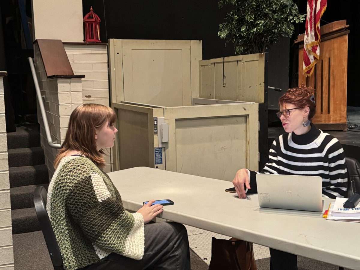 HERE WE GO AGAIN! • Director Mandie Banks discusses rehearsal plans with sophomore and student
director Caroline Boerth.