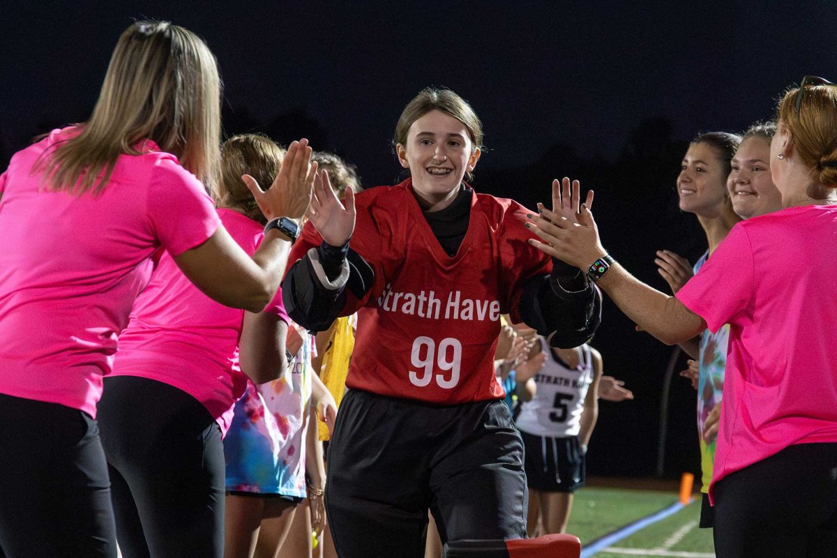 Sophomore goalie Laila Roe runs through the spirit line prior to the Panthers varsity field hockey home game against Upper Darby on October 15. The Panthers won againsts the Royals 4-0.