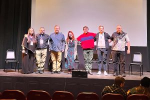 Leah Cevoli, Chris Pierdomenico, Brian O’Halloran, Jenn Keurzi, Steve Harding, Jeff Pfeiffer, Paul Marturano (left to right) smile for a picture following the movie premiere screening and Q&A at the Media Theatre on Sunday, January 19. 