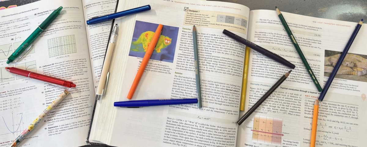 'Study' is spelled out across textbooks with colored pencils and pens.