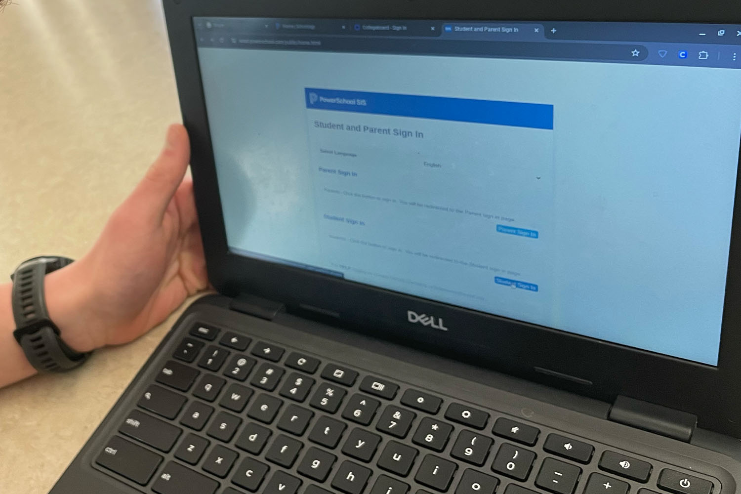 A Chromebook displays the PowerSchool sign-in page. WSSD students and staff utilize PowerSchool products including Schoology.