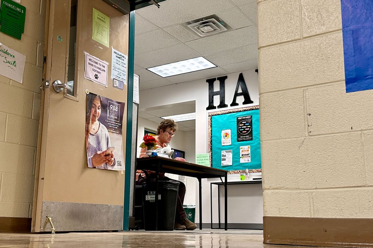 The counseling office experiences a rare quiet moment on Wednesday, February 26, as administrative assistant Mrs. Debbie Seifrit works on paperwork after school. (K. Plows)