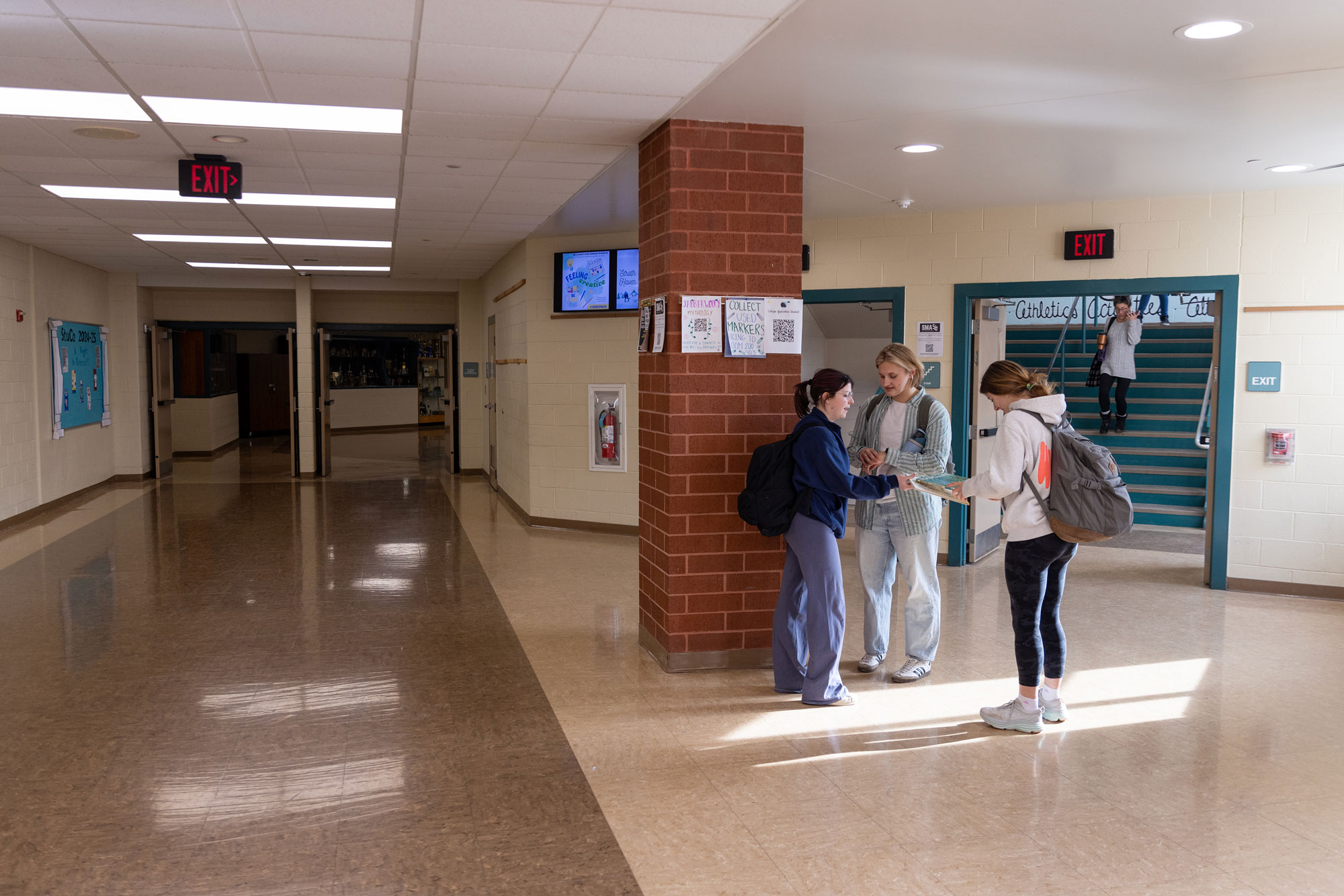 Students socialize outiside of the main staircase on the second floor at the begininng of fifth block on Wednesday, February 5. Students utilize fifth block time to connect with music, extracurriculars, and academics.