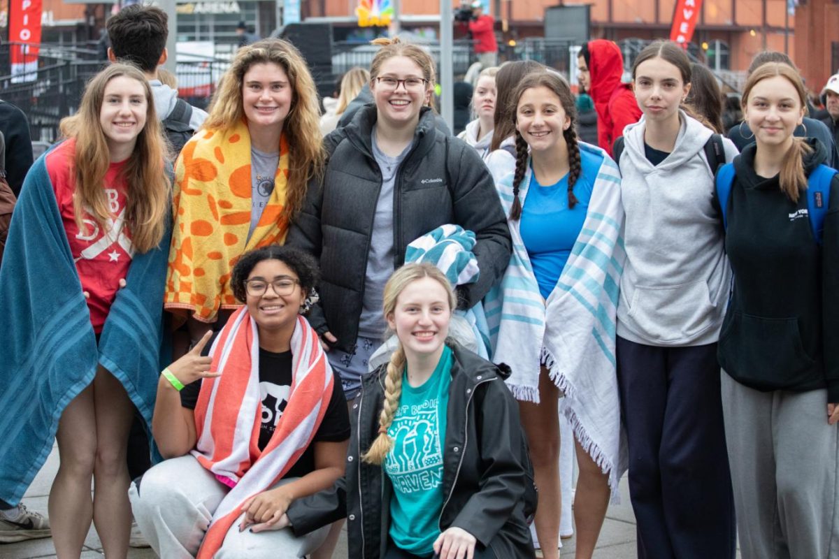 Seniors Molly Conallen, Emily Reilly, Ella Liberi, and Zoe Likely and sophomores Kathryn Barrett, Lilla Burke, and Shayla Hainsworth smile for the camera, ready for the plunge. 