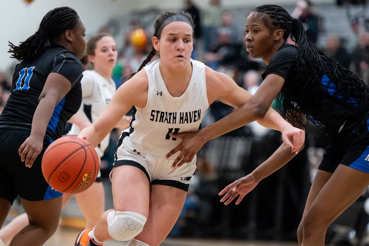 Senior Olivia Voshell pushes though Academy Park's defense as she attempts to score a basket during the senior day match up on Saturday, February 8 in the Strath Haven High School Gymnasium. Voshell lead the game as the top scorer with a total of 19 points.