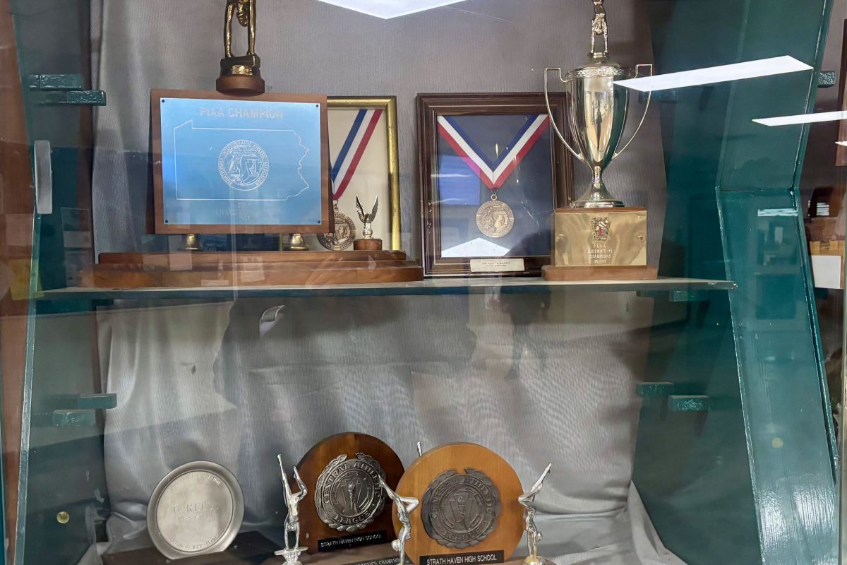 The trophy cases outside the library contain gymnastics trophies from the old team.  