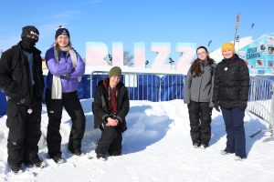 Sophomores Will Walker, Mateo Laurent, Roxy Shelton, junior Mia Fagone, and senior Annika Grant pose at one of the Quebec Winter Carnival sites on Saturday, February 15.