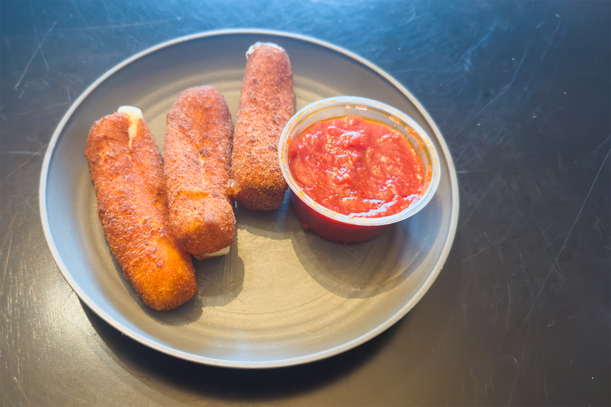 Mozzarella sticks from Pinnochio's Restaurant accompanied by Marinara sauce.