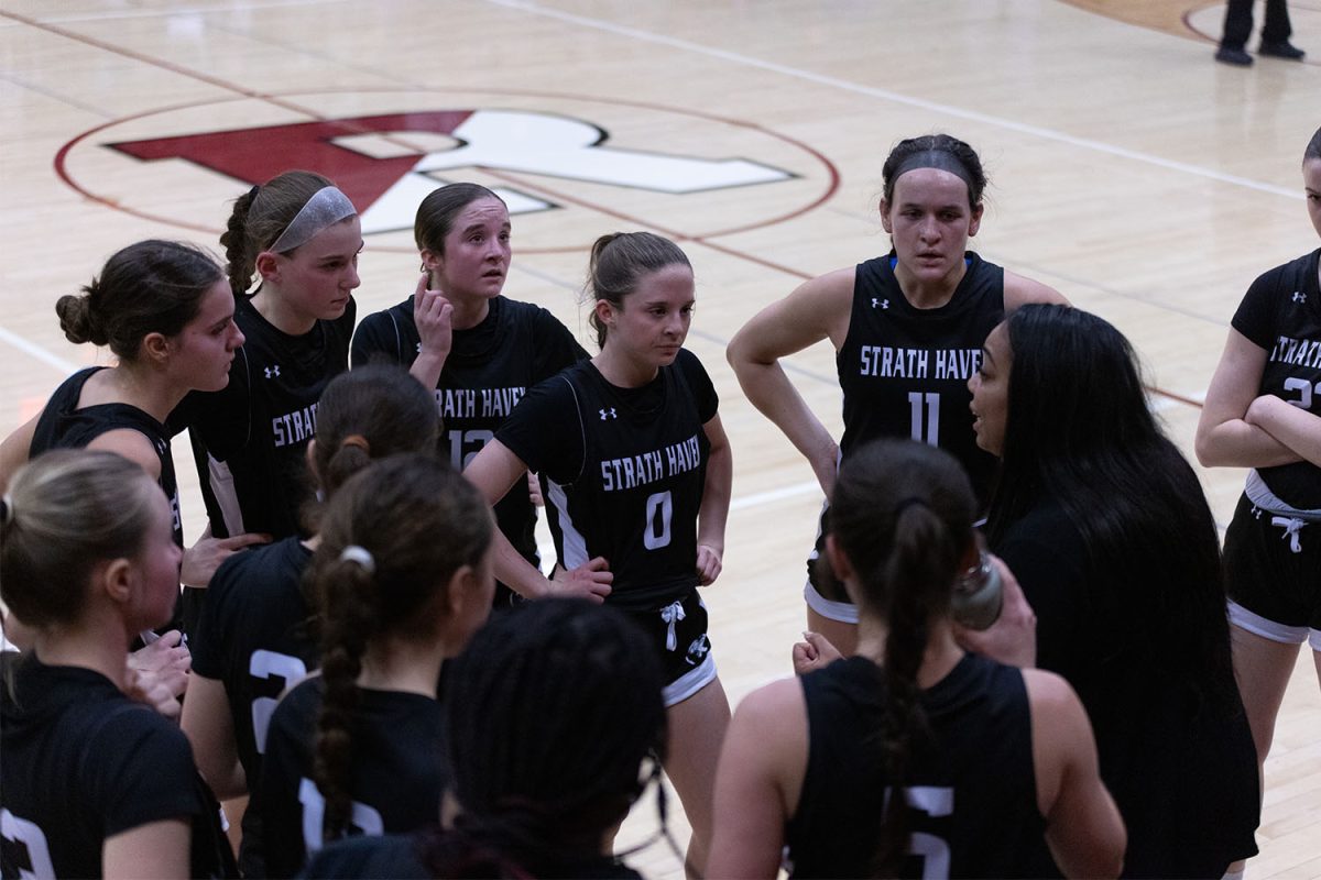 The girls basketball team listens to head coach Brandi Johnson during her halftime talk during round two of the PIAA 5A District 1 playoff game. 