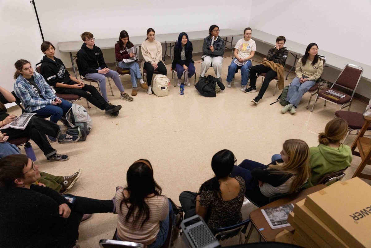 Panther Press members sit in a circle in the photo studio of room 223 as they await a meeting with principal Mr. Andrew Benzing in an afternoon meeting on Tuesday, January 14.