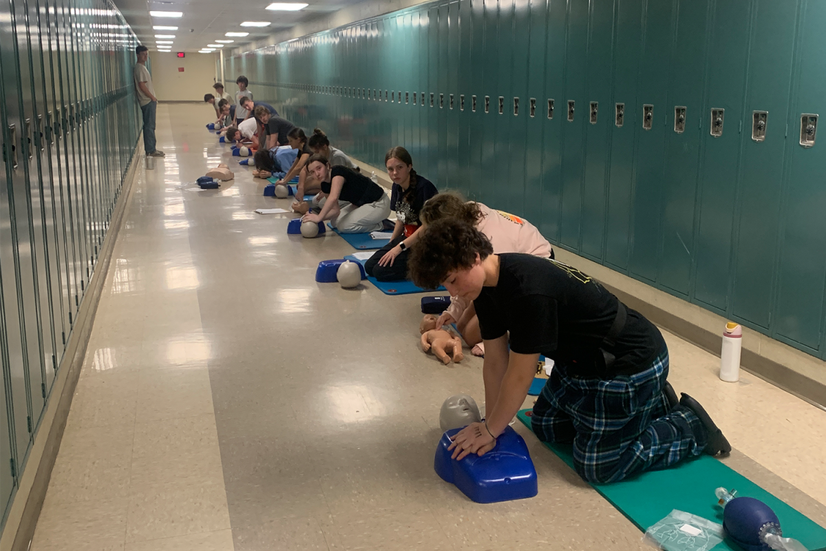 Students practice CPR. The class, which is offered during the weekends, focuses on advanced CPR and AED training.
