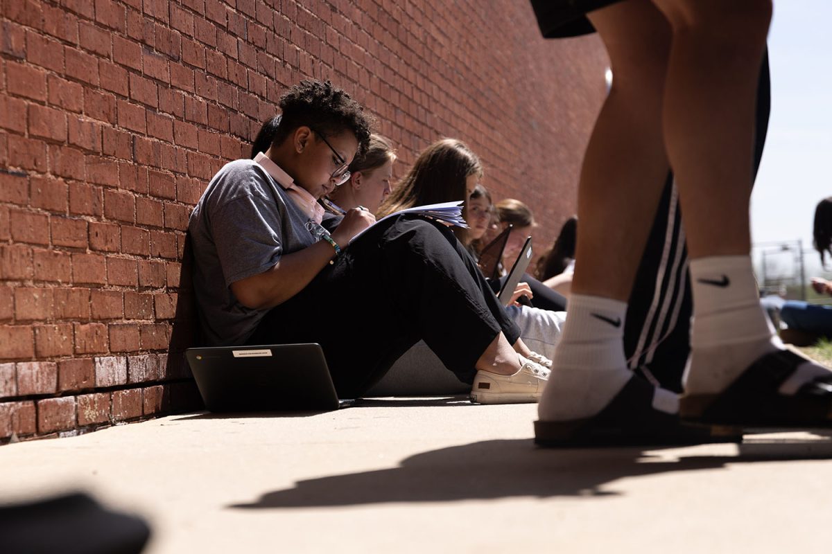 During fifth block on Tuesday, April 8, students utilize the outdoor lunch tables to catch up on homework or wait for a ride. This is one of the many outdoor learning spaces that students have the ability to use.