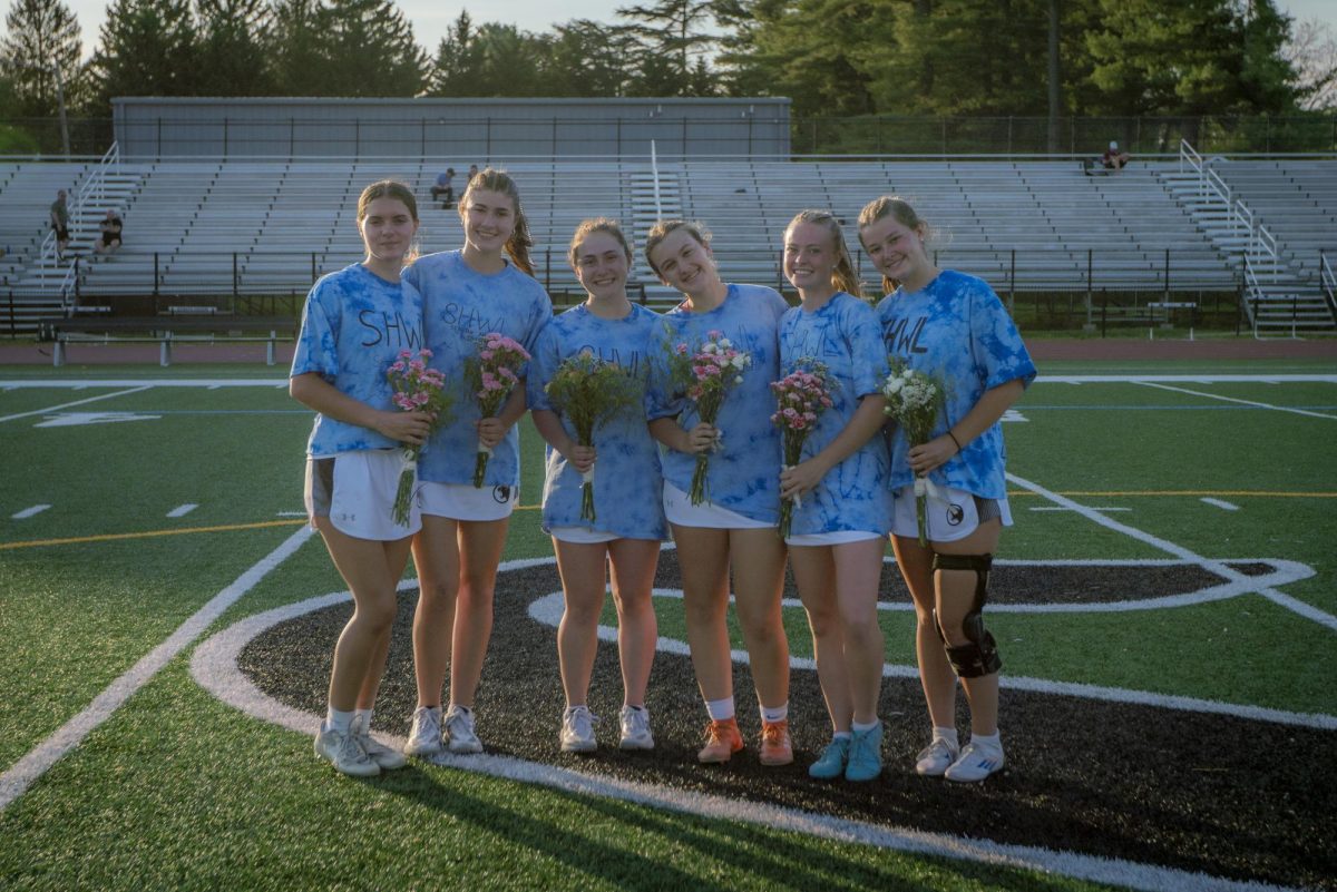 The six seniors pose for a photo after their senior night celebration at George L. King Field on Friday, May 2.