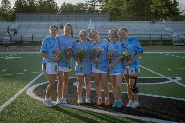 Navigation to Story: PHOTOS: Girls lacrosse dominates on senior night
