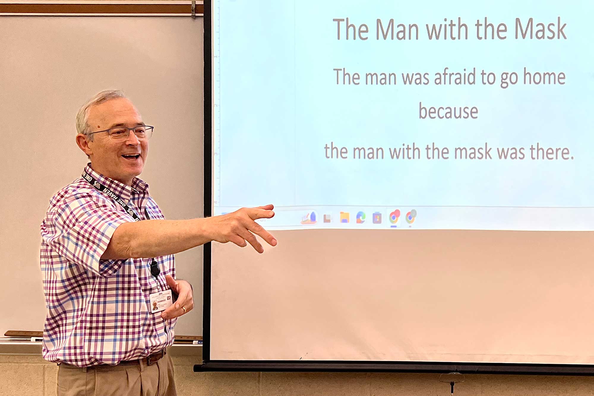 Science teacher Mr. John Lincke excitedly calls on a student during a Friday brain teaser day.