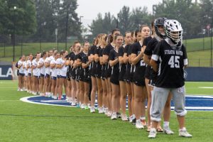 Both teams line up for the national anthem in the PIAA 2A state final in State College on Saturday, June 14.